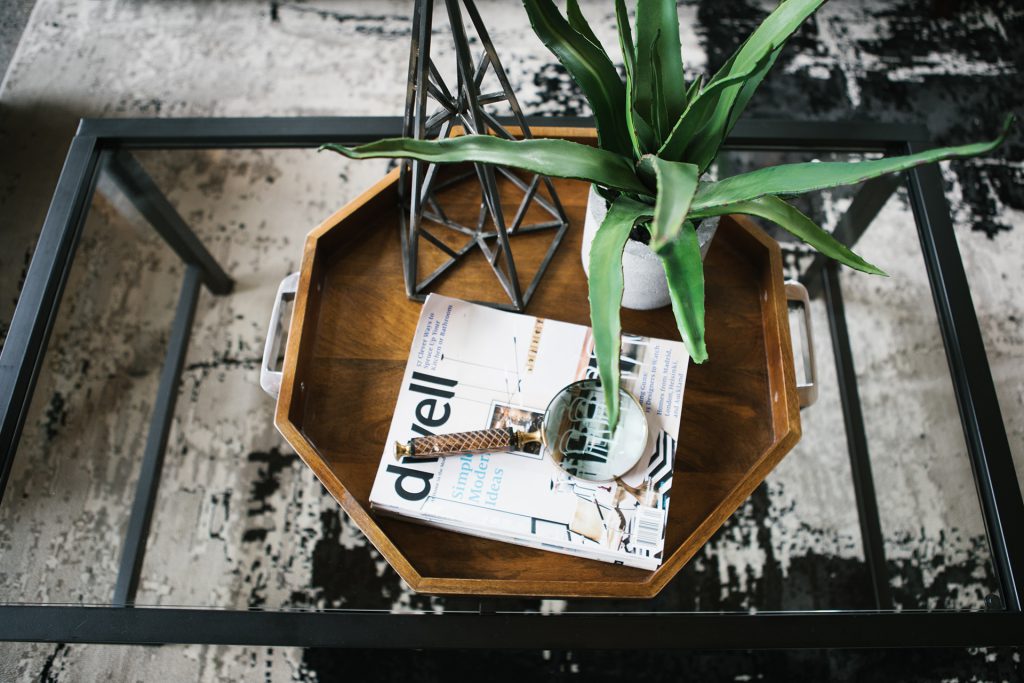 Cozy rustic decor with plants and wooden elements.